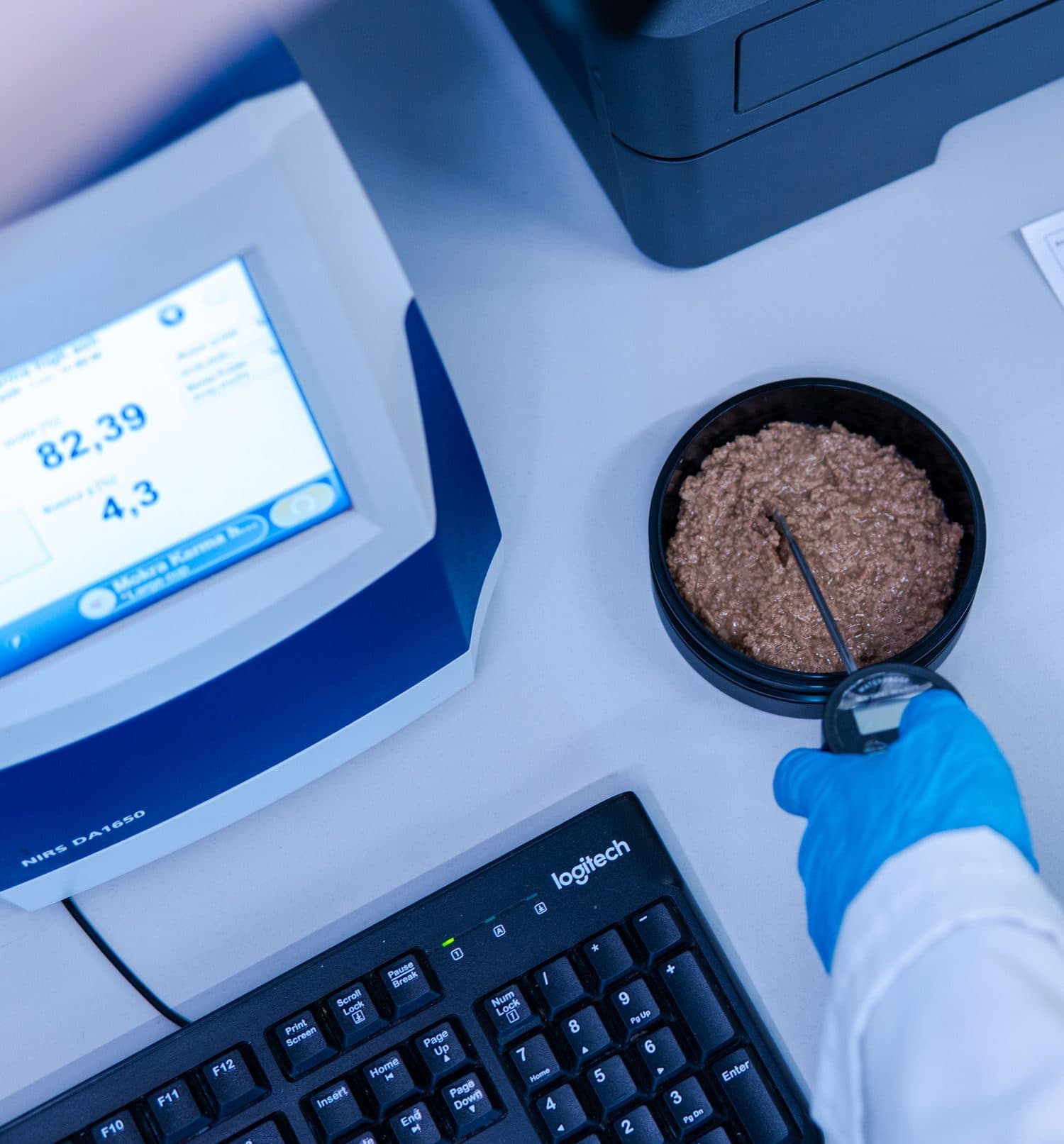 Quality control laboratory with scientist analyzing samples
