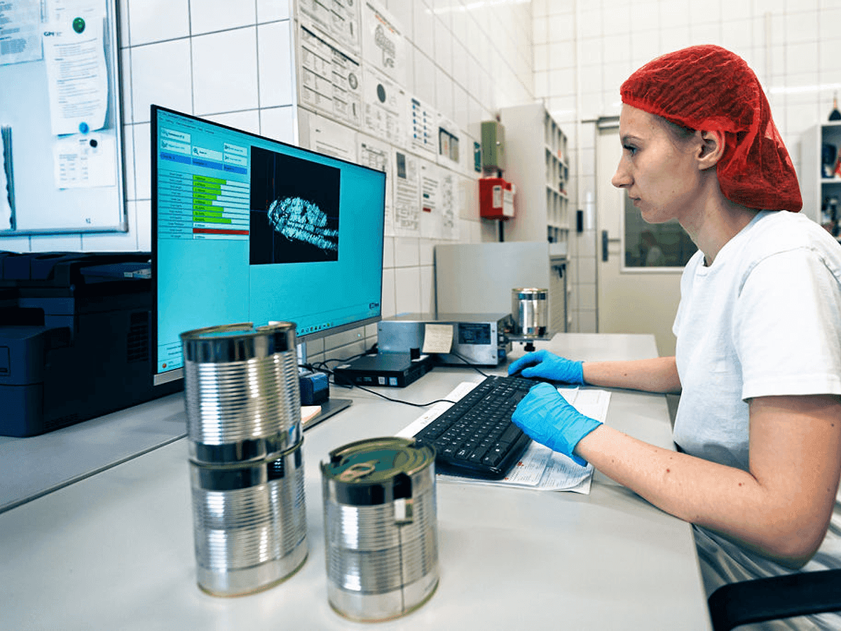 Quality control laboratory with scientist analyzing samples